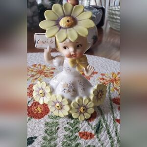 Charming April Flower Girl Cake Topper - Yellow and White